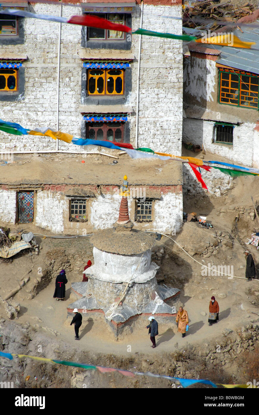 Buddhist pilgrims walking around a holy stupa at a Buddhist convent, Tidrum, Tibet, Asia Stock Photo