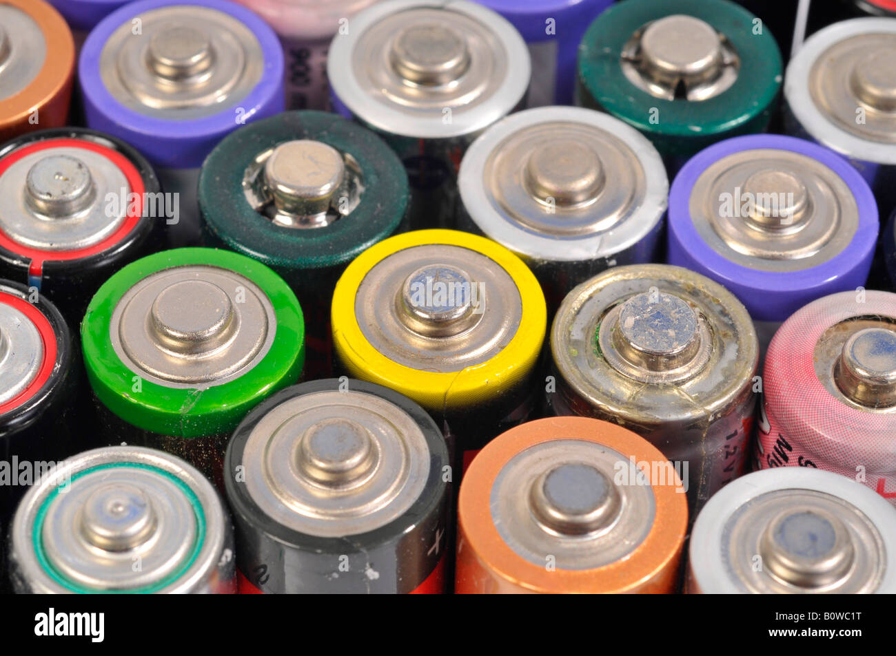 Used, empty AA and rechargeable batteries Stock Photo