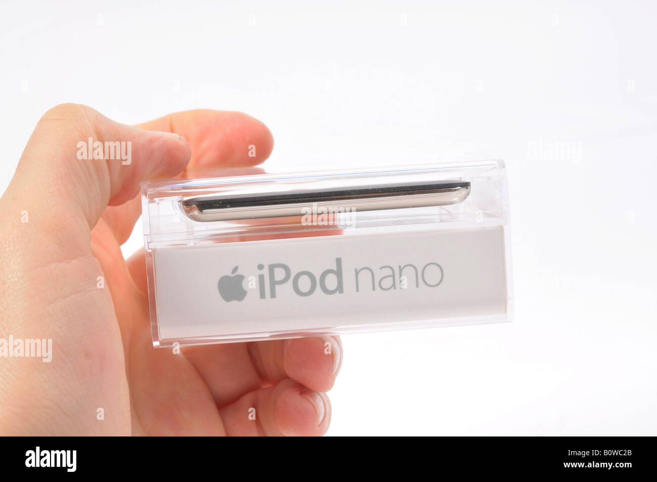 Hand holding Apple iPod Nano, black, in original packaging Stock Photo