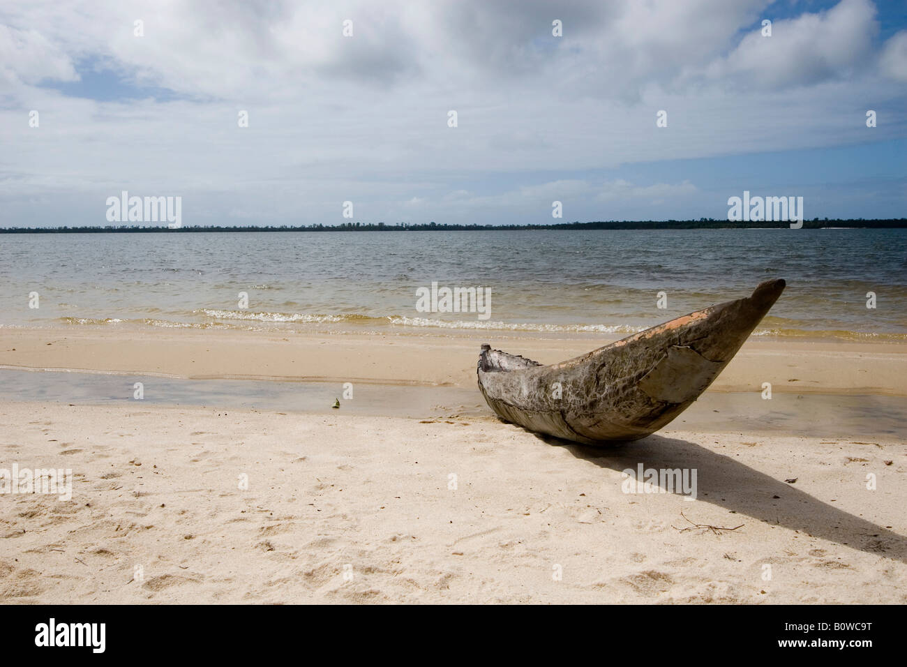 Logboat or dugout boat on a beach in Manambato, Madagascar, Africa Stock Photo