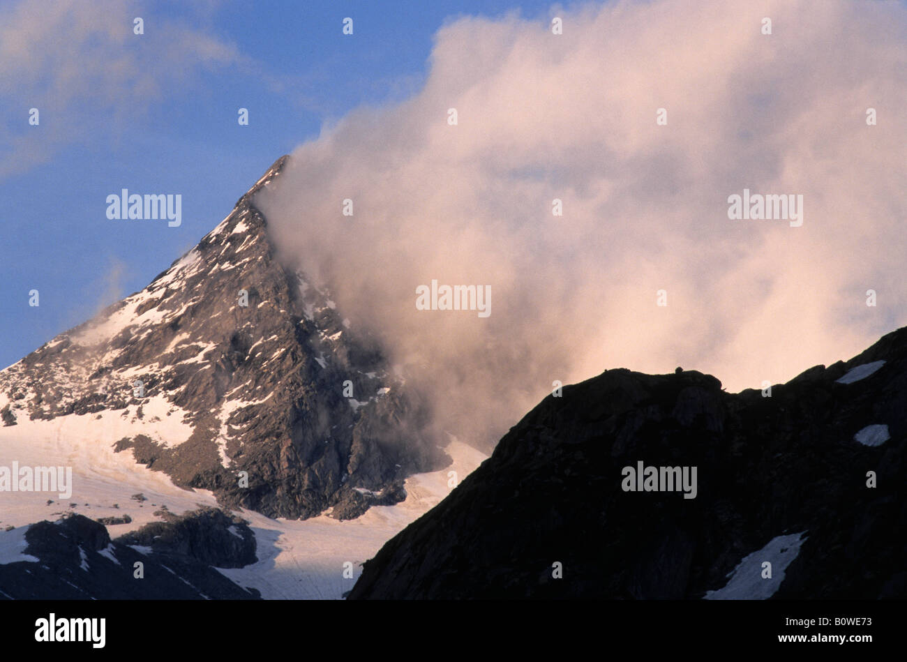 Shreds of cloud above a mountain in the evening light, Zillertal Alps, Tyrol, Austria, Europe Stock Photo