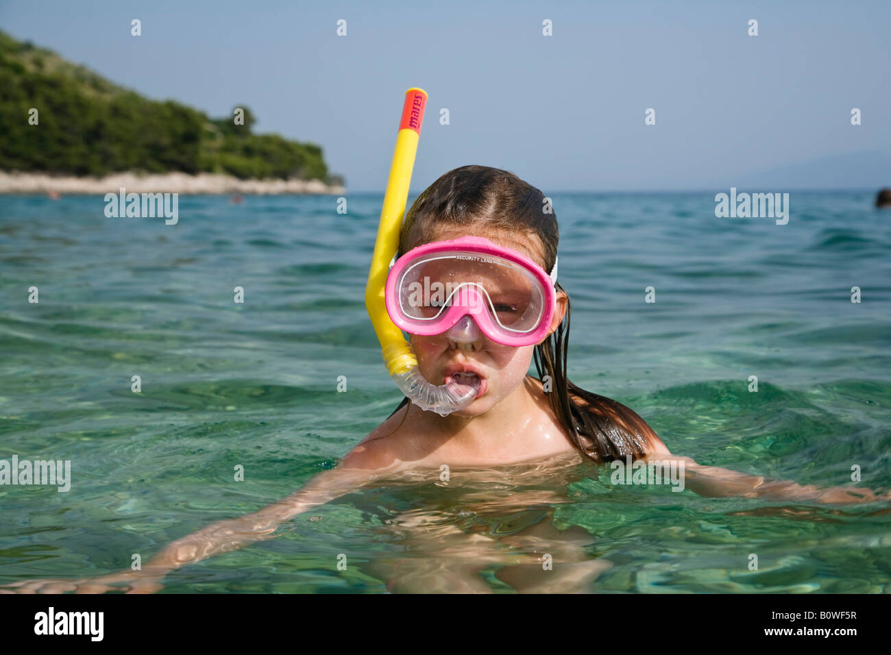 Little girl wearing a diving mask and snorkel, Croatia, Europe Stock Photo