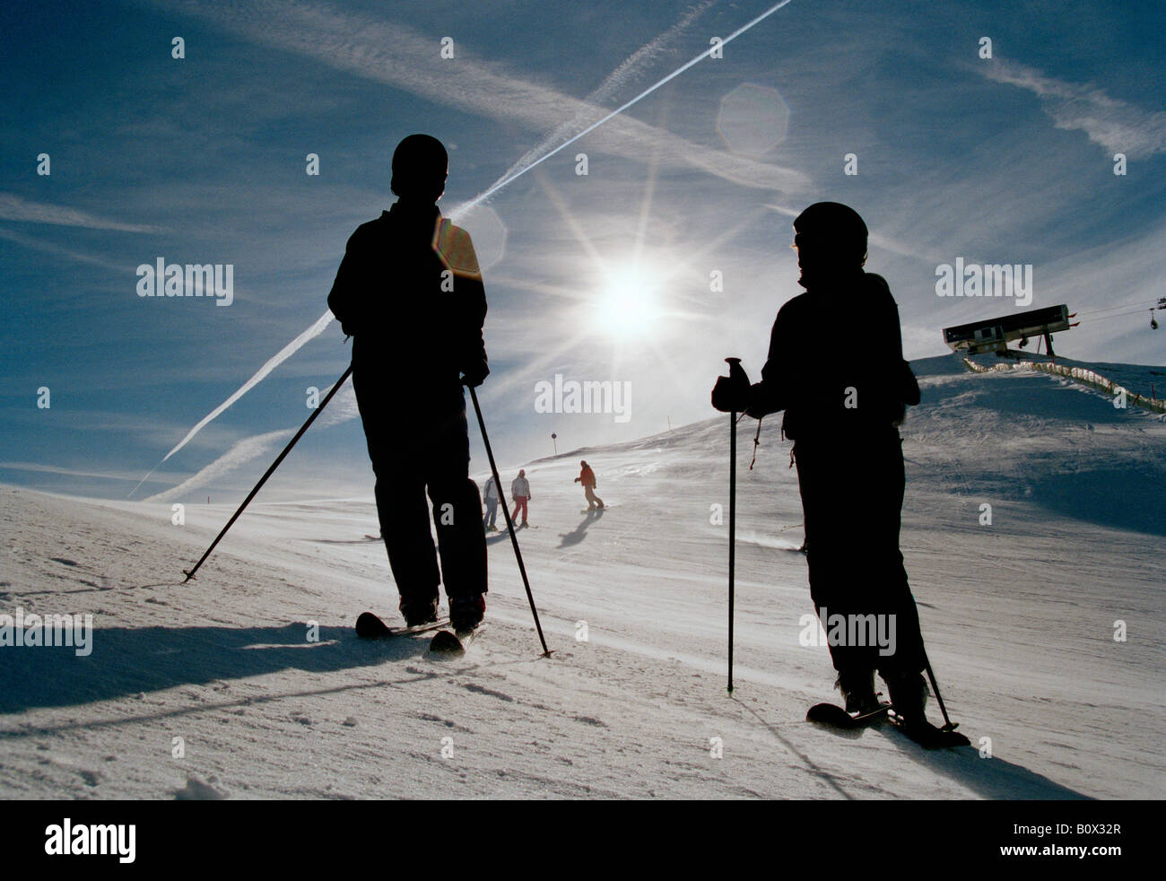 Skiers on a ski slope Stock Photo