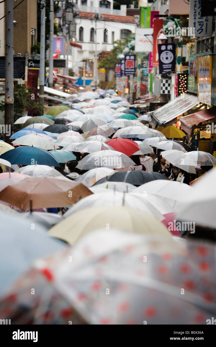 A street in Japan crowded with people carrying umbrellas Stock Photo