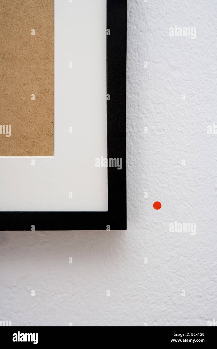 A picture frame with a red sticker next to it Stock Photo - Alamy