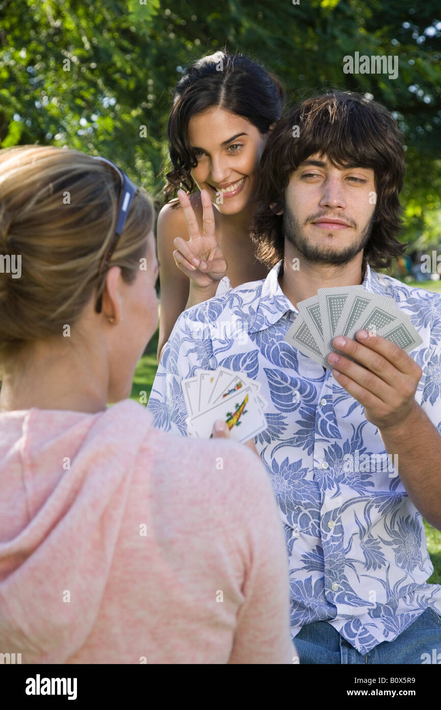 Friends playing cards Stock Photo - Alamy