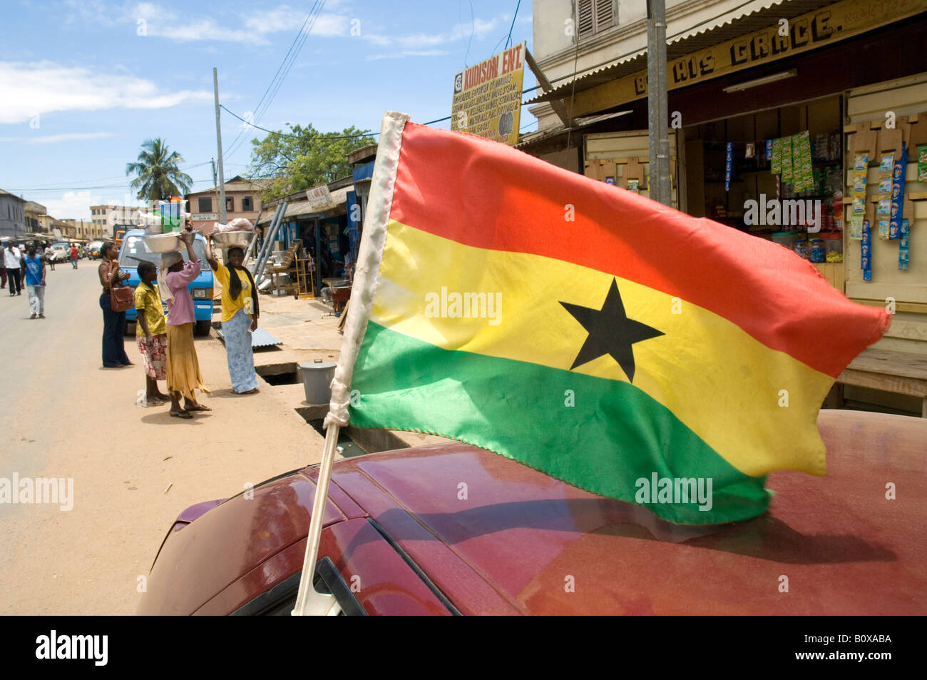 Car with the National flag of Ghana in the streets of Accra Stock Photo