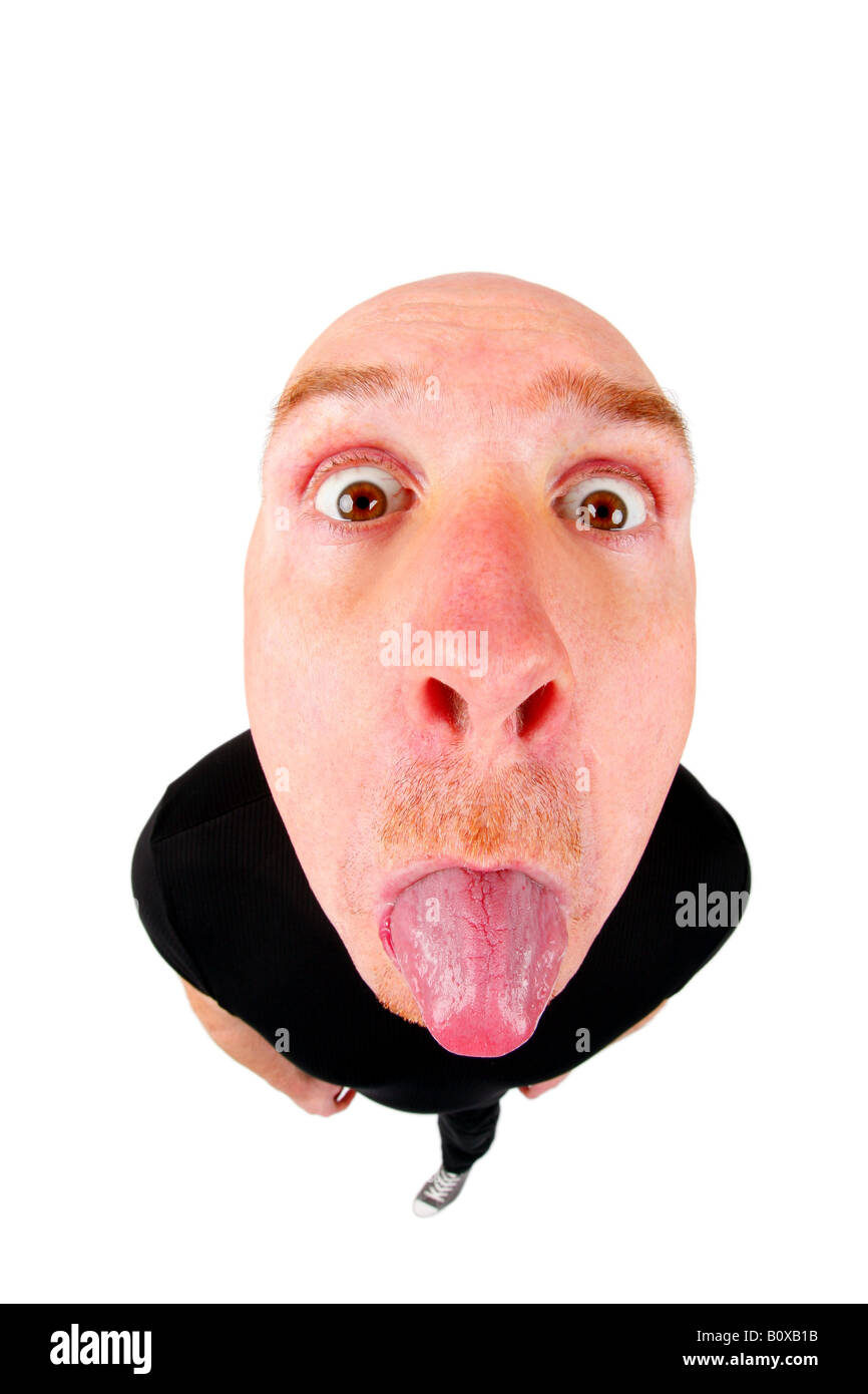 bald headed man poking tongue out Stock Photo
