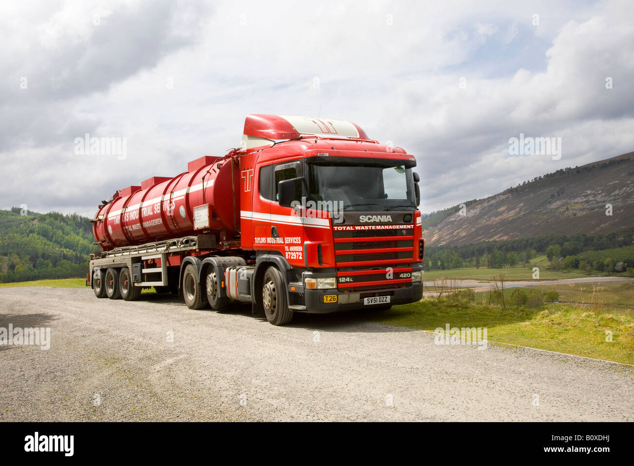 Red parked Tanker, Pump-out Trucks    Total Waste Management Scania 124L 420 Stock Photo