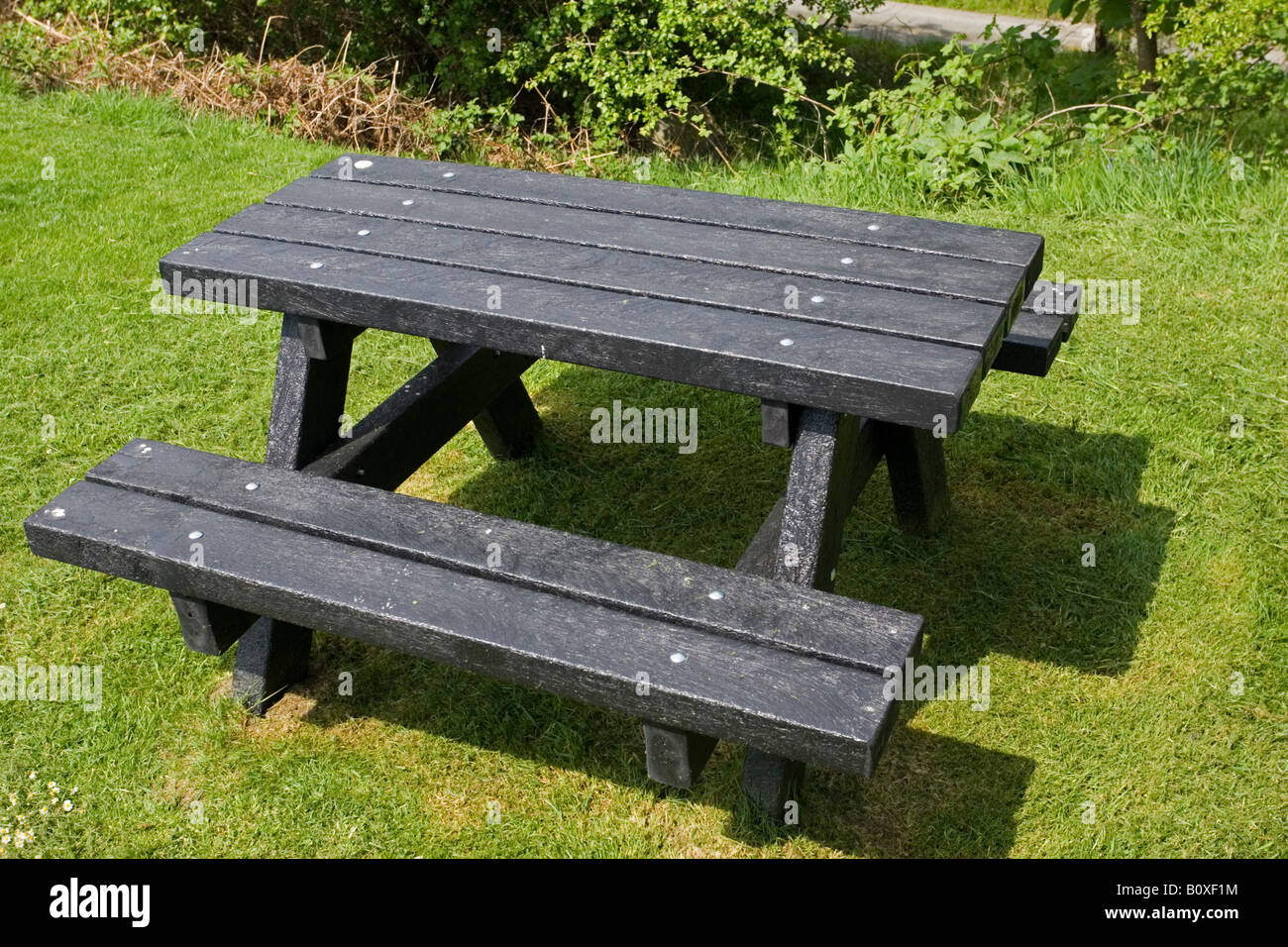Black picnic bench made from plaswood Clywedog Reservoir Powys Wales UK Stock Photo