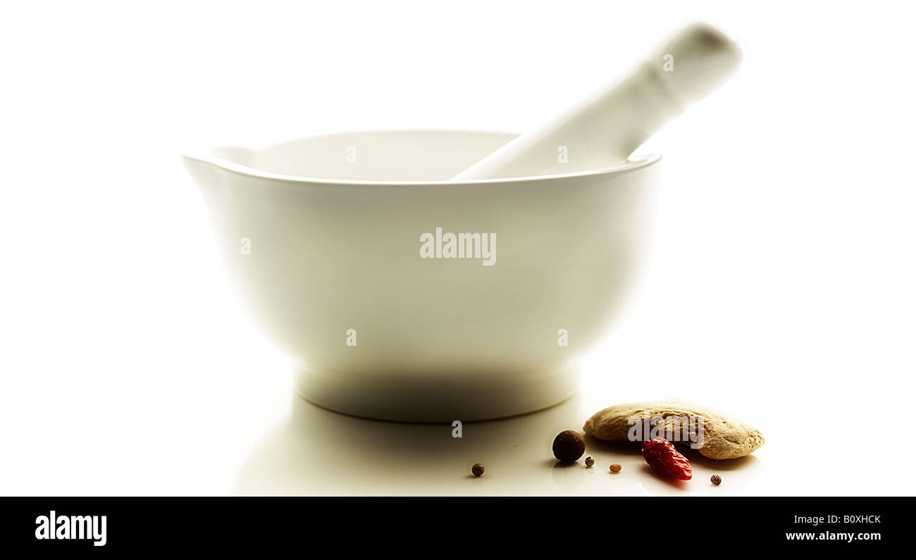 Mortar and pestle with mixed nuts Stock Photo Alamy