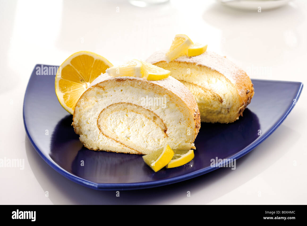 Swiss roll filled with lemon cream Stock Photo