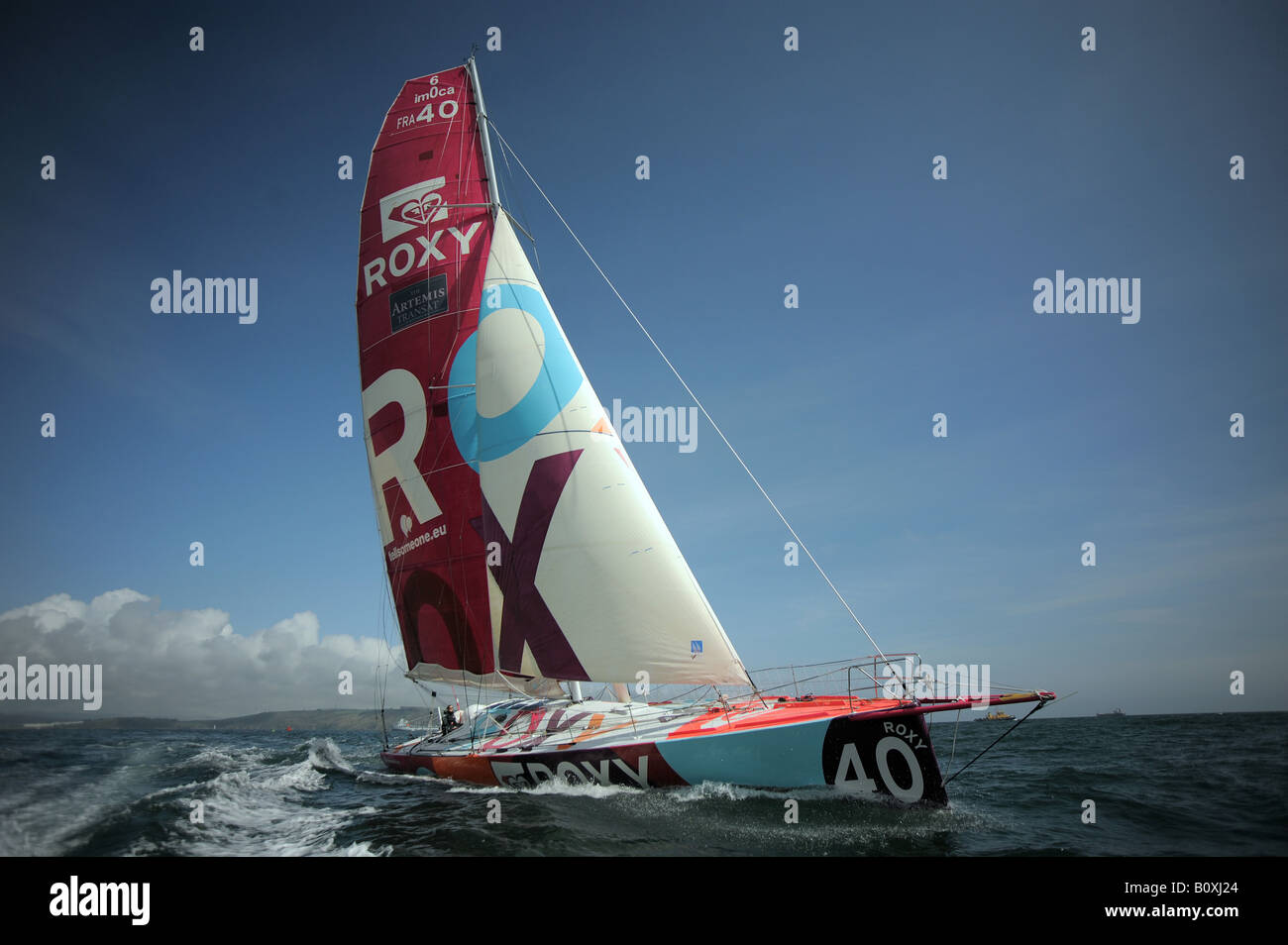Sam davies sailing the Quiksilver Roxy boat in the Artemis Transit race in Plymouth, Devon, UK. Stock Photo