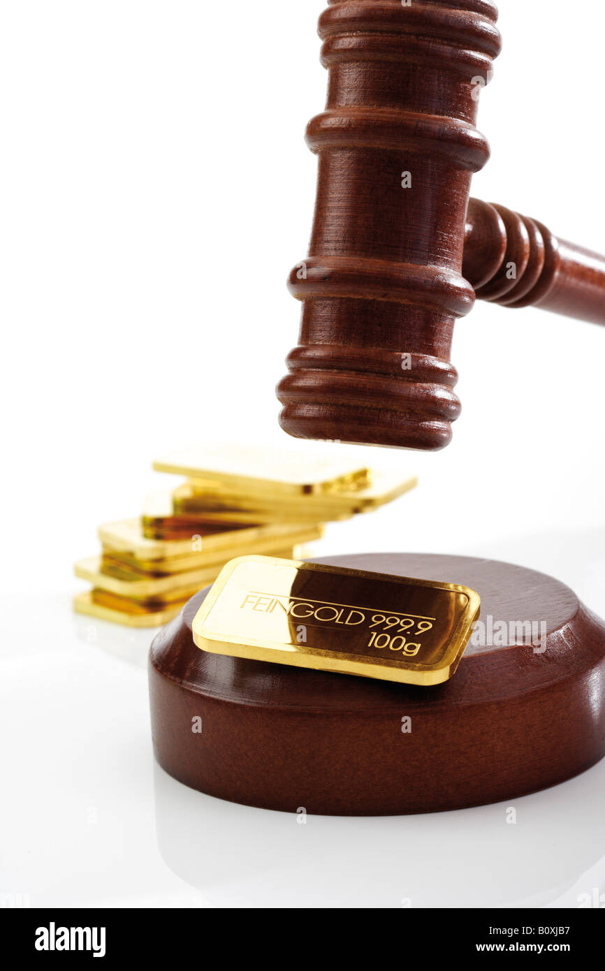 Auctioneer's hammer and gold bar Stock Photo Alamy