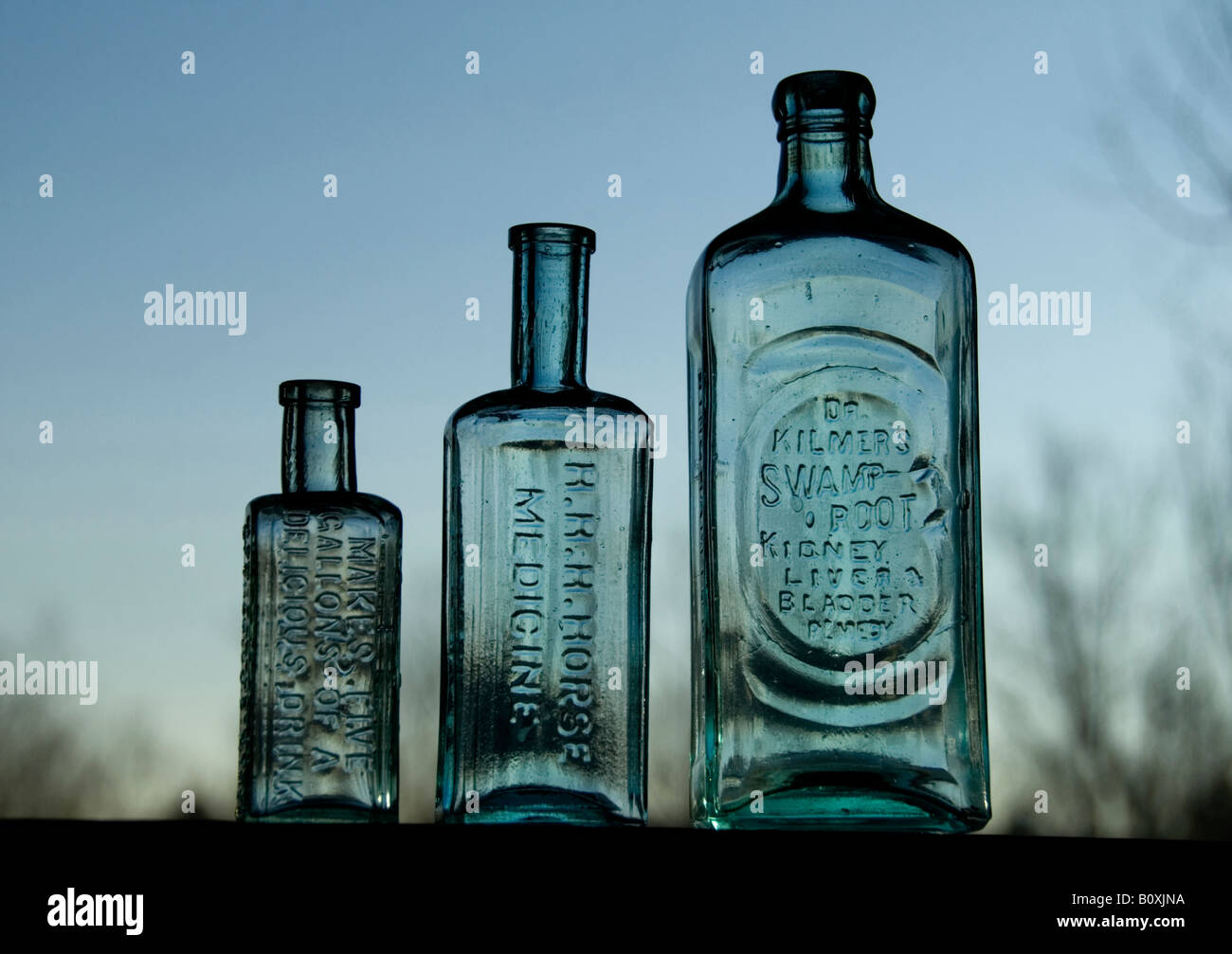 Early morning backlighting on antique bottles from the US Stock Photo