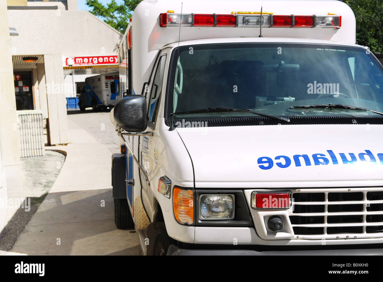 Abmulance vehicle in front of an emergency entrance to a hospital Stock Photo