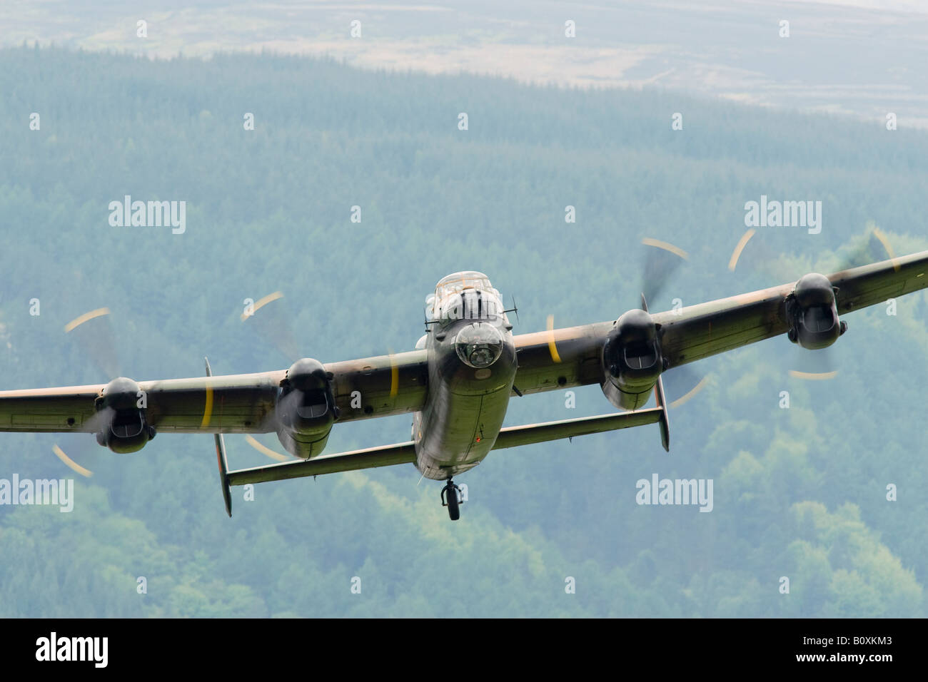 Battle of Britain Memorial Flight Lancaster flying over Derwent Reservoir Derbyshire England Stock Photo