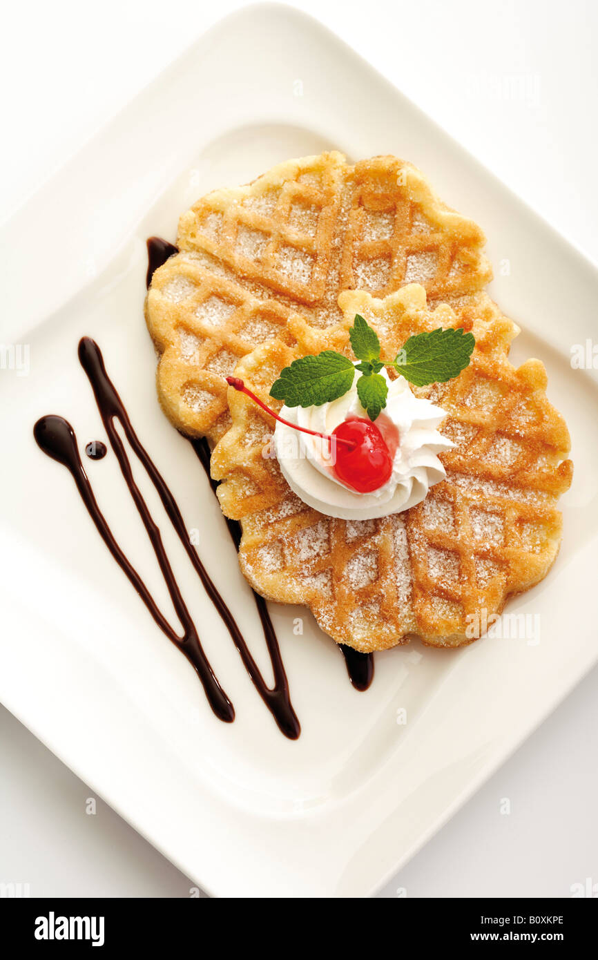 Waffle with whipped cream Stock Photo Alamy