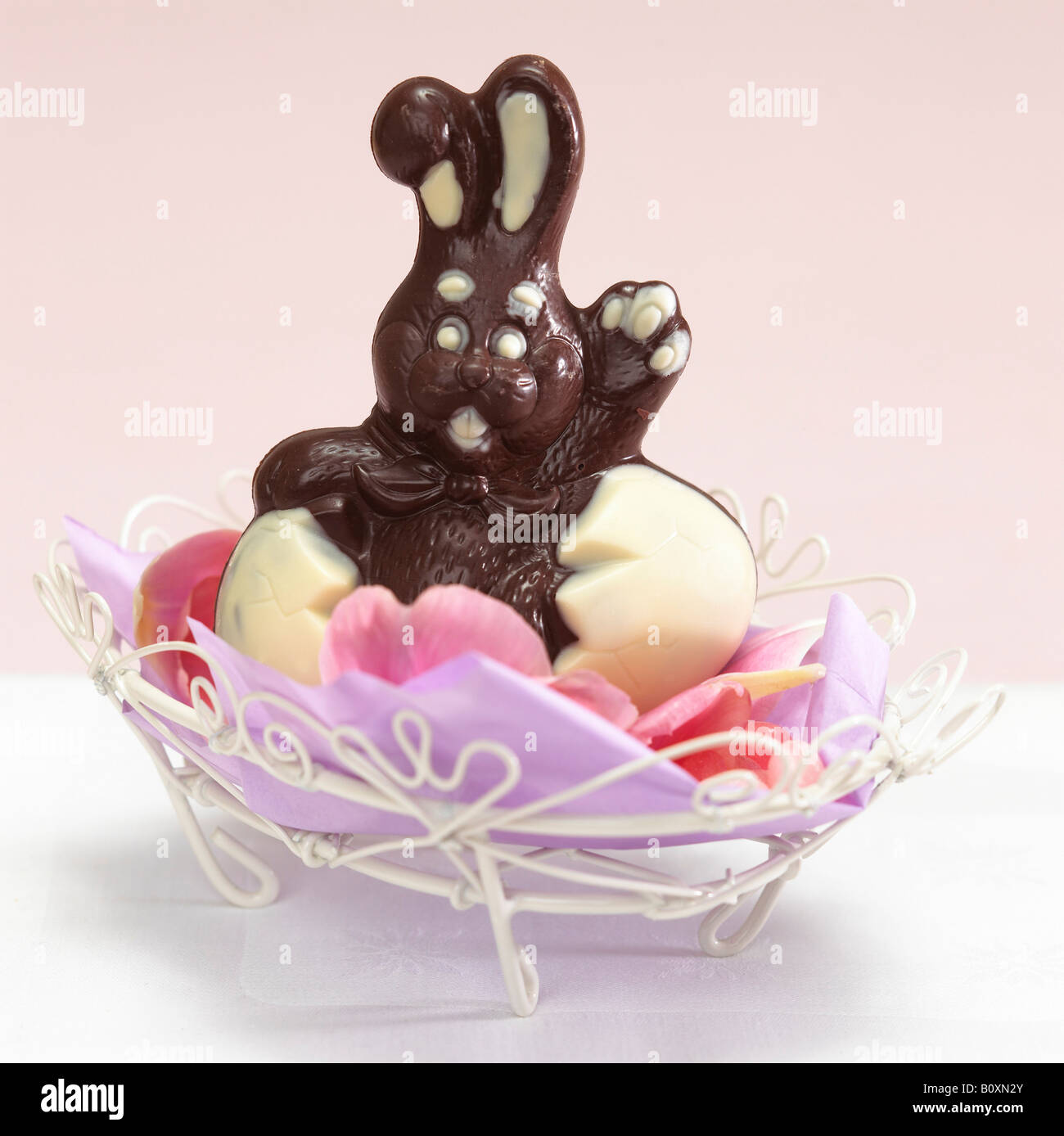 Chocolate easter bunny in basket Stock Photo Alamy