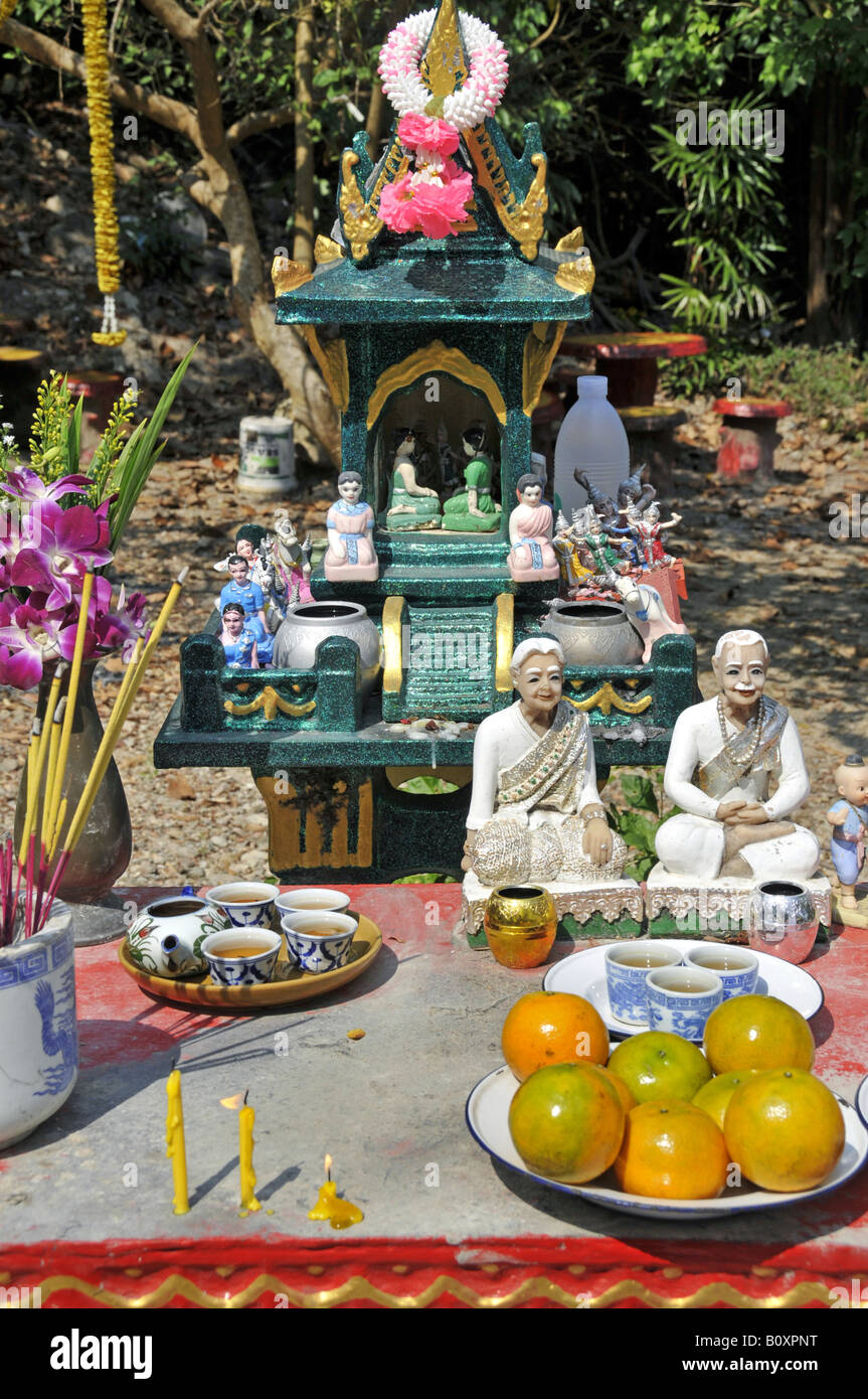 oblations at a spirit house, Thailand, Koh Chang Animismus Stock Photo
