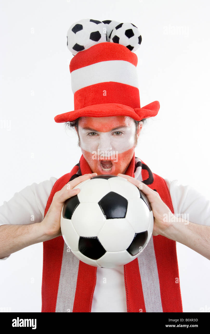 Austrian soccer fan with funny hat and football in his hands Stock Photo