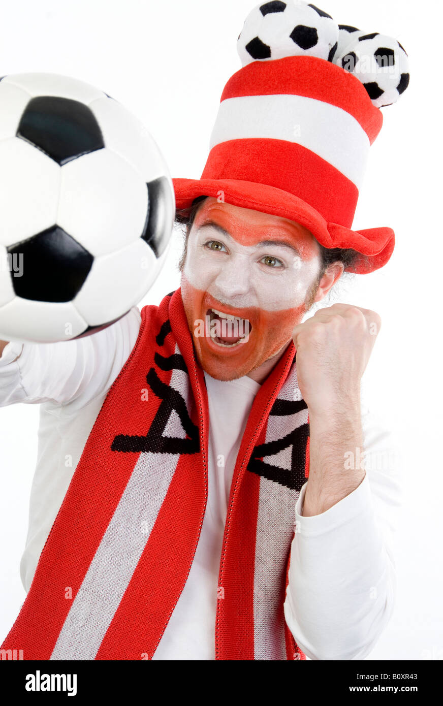 Austrian soccer fan with funny hat and football, cheering on Stock Photo