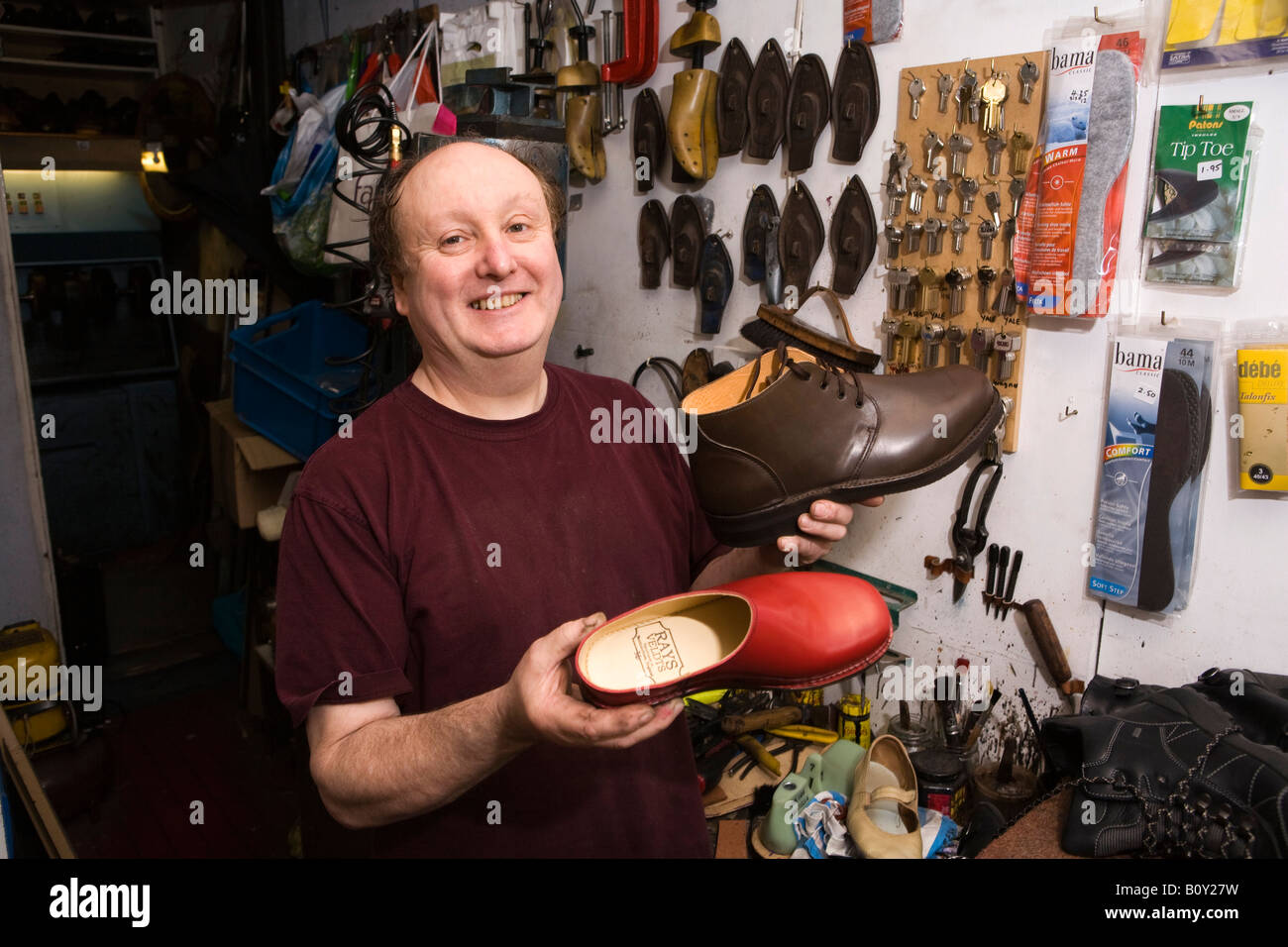 UK England Suffolk Saxmundham High Street shoemaker Ray Friedman in his