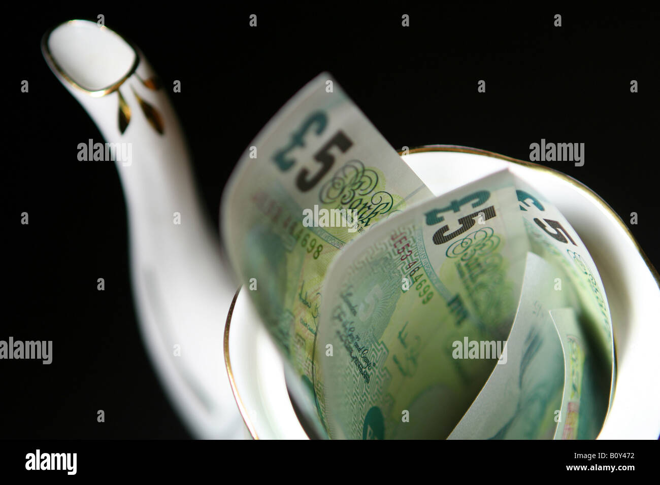 £5 notes in a teapot Stock Photo Alamy