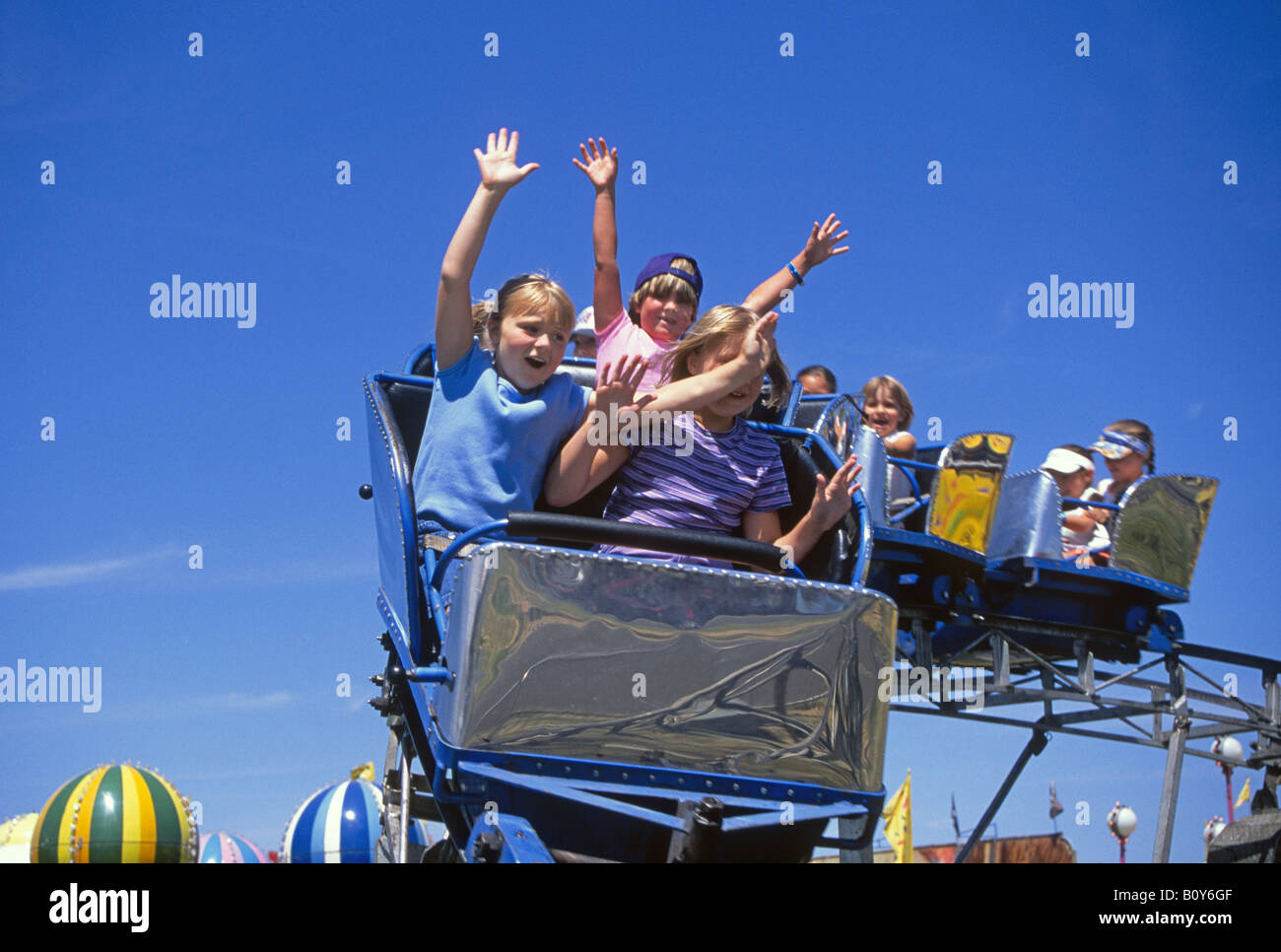 Children have fun on a roller coaster at the Deschutes County Fair in Redmond in July Stock Photo