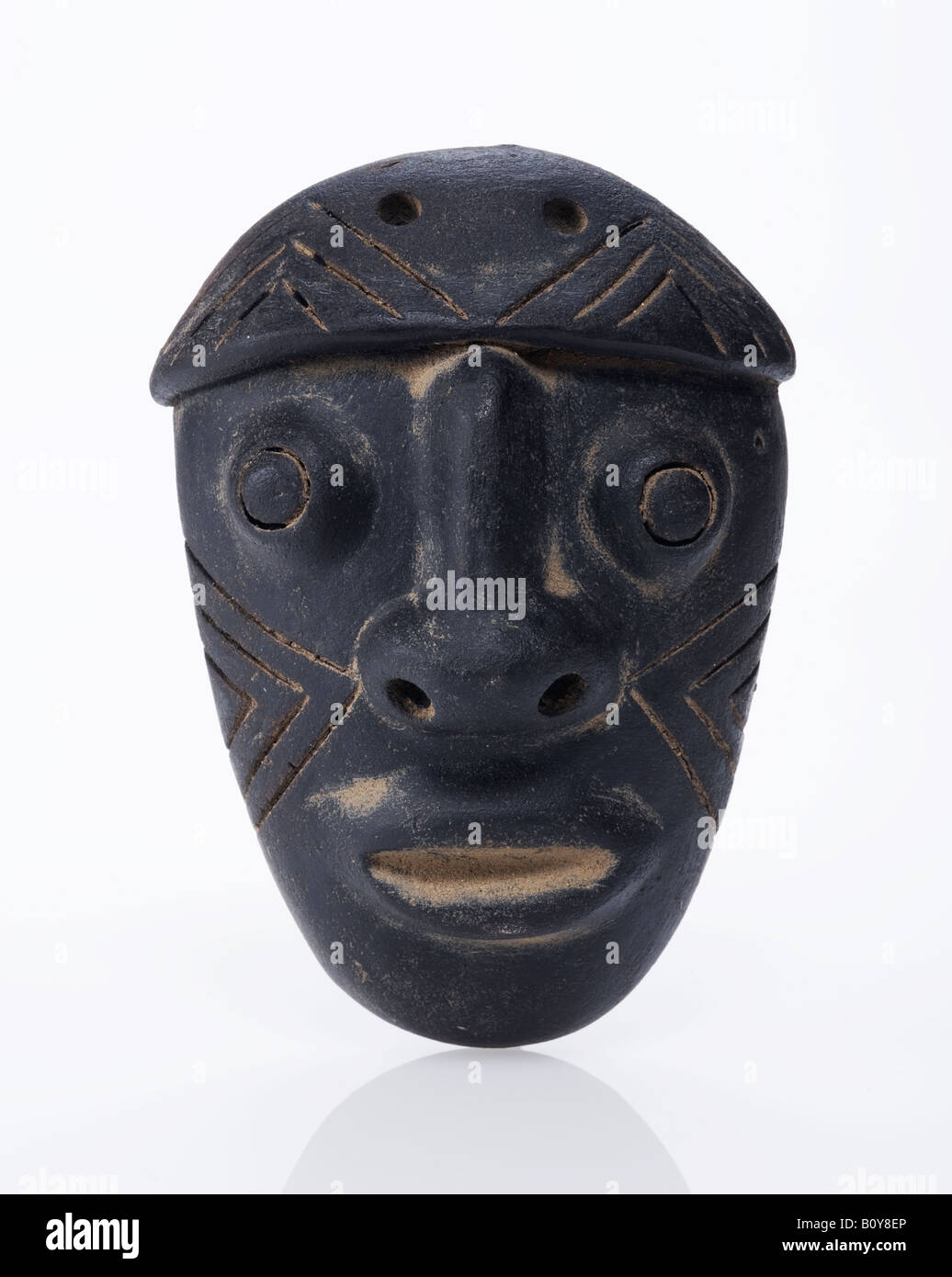 black ceramic mask made by indigenous artists in Costa Rica Stock Photo