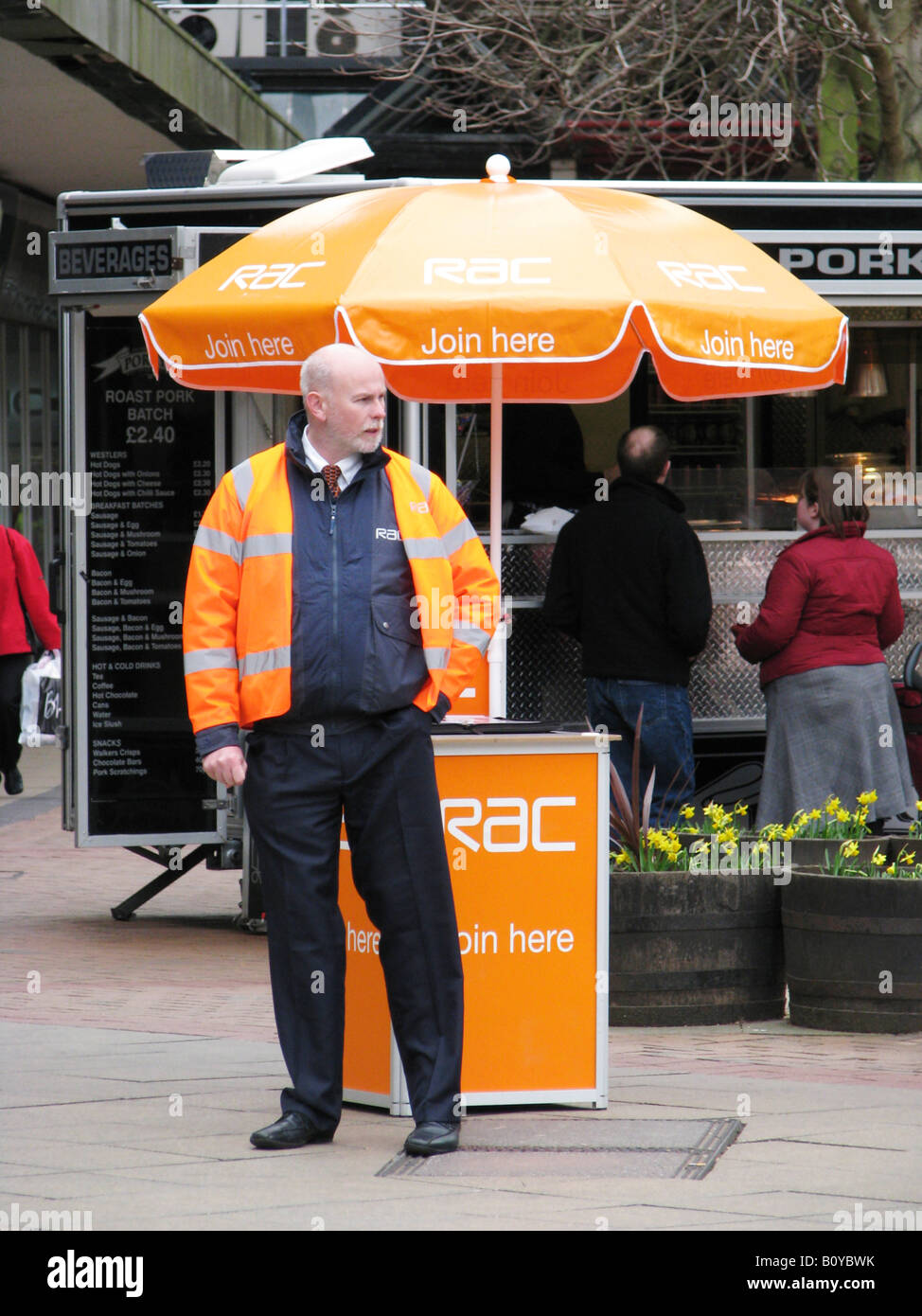insurance agent of an english insurance company in the city centre trying to attract new clients, United Kingdom, Coventry Stock Photo