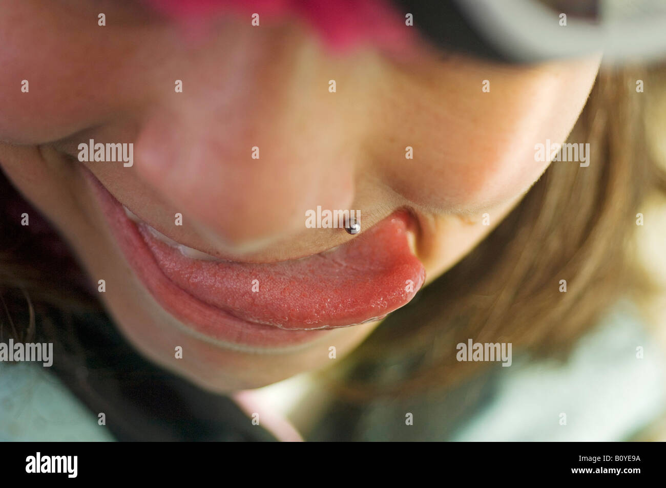 piercing of a 13 years old girl Stock Photo