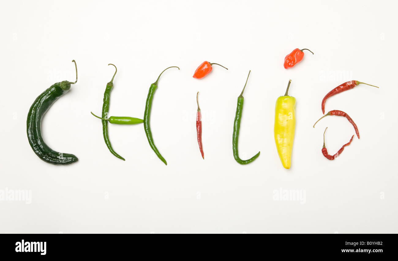 The word Chilis spelled out using various peppers Stock Photo