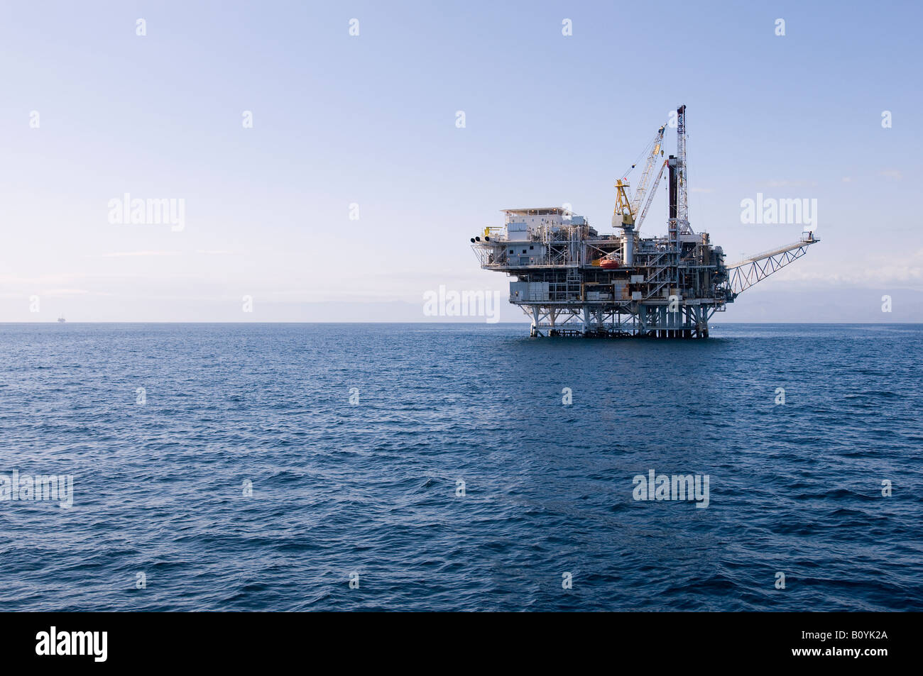 An offshore oil drilling platform stands in the Pacific Ocean off the coast of Southern California. Stock Photo
