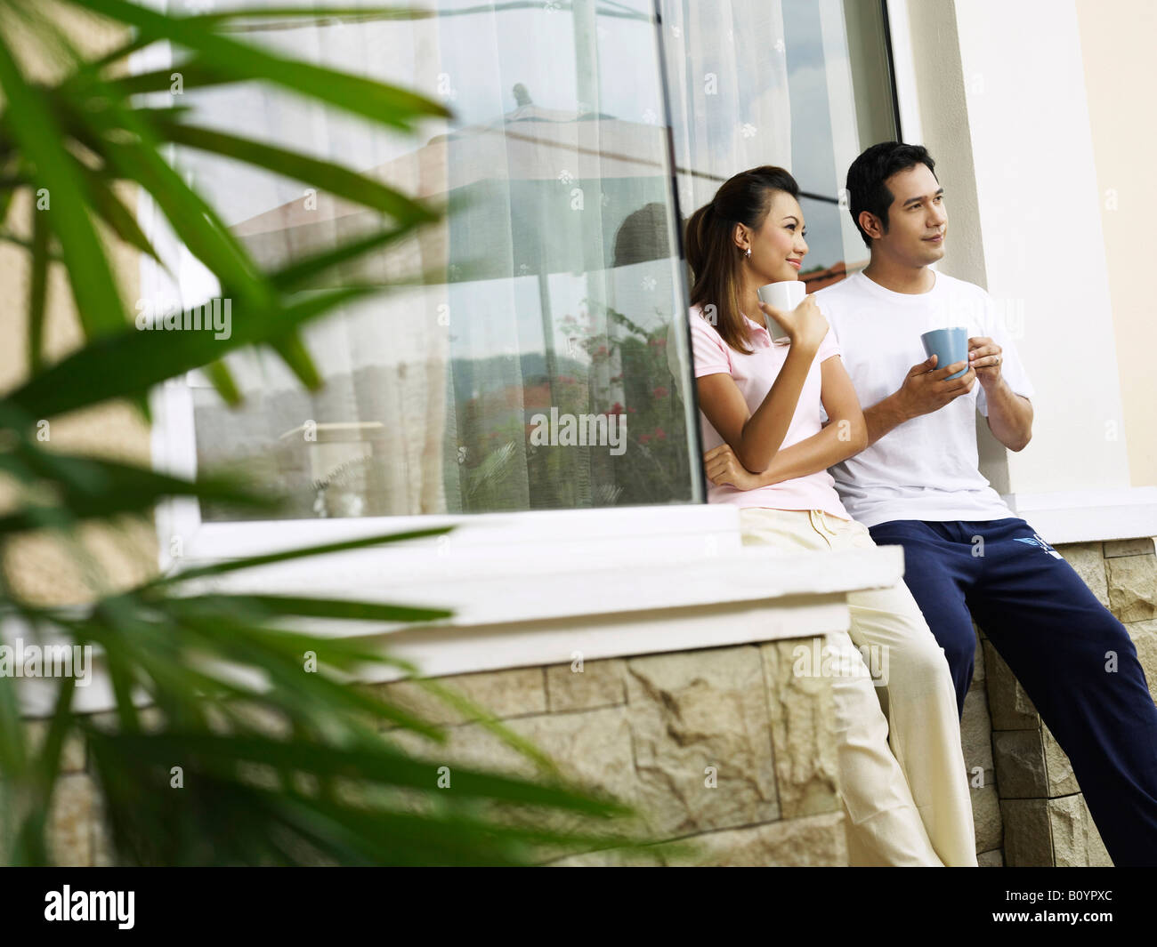 Husband and wife chatting in the garden Stock Photo