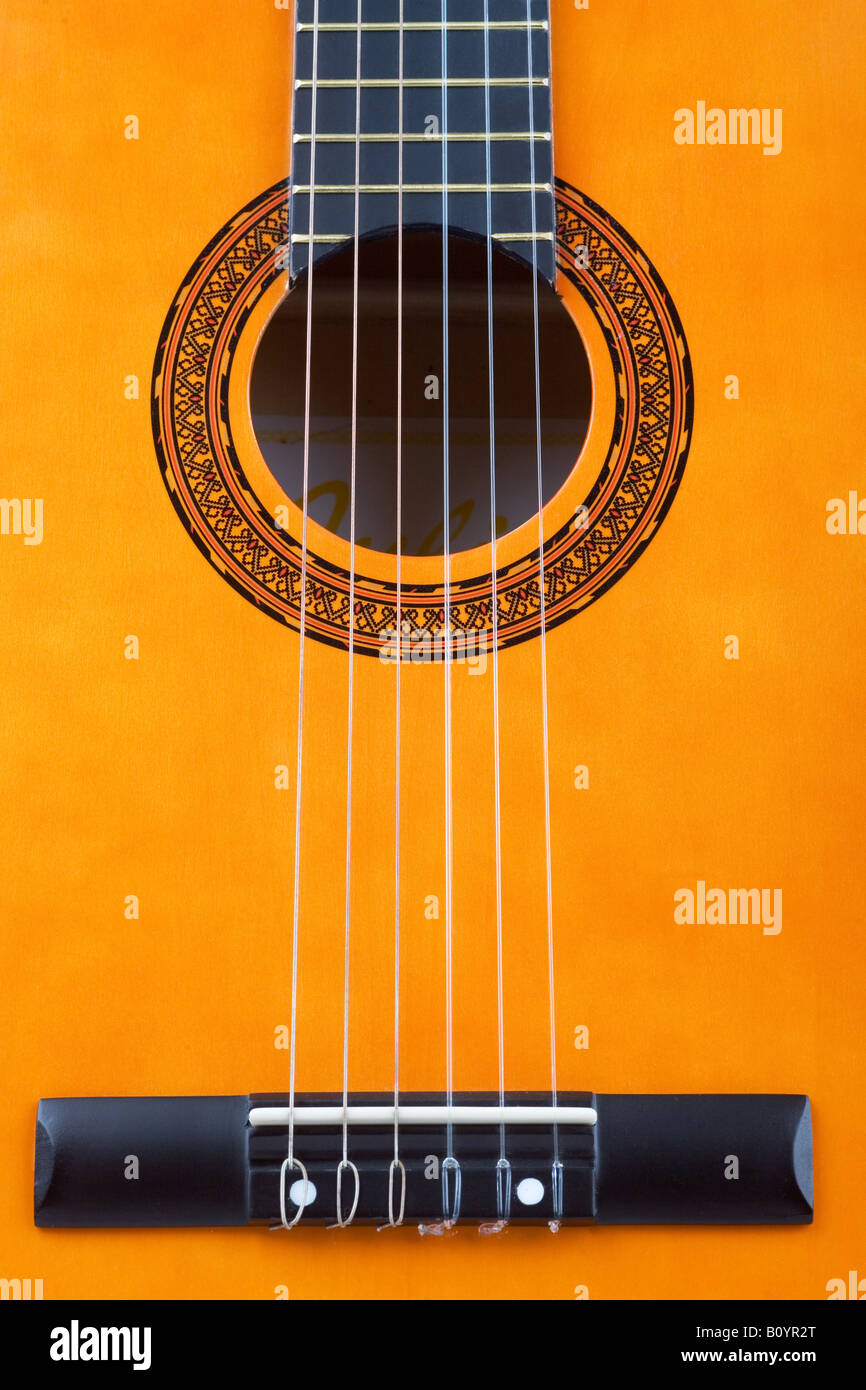Acoustic guitar bridge and strings close up Stock Photo Alamy