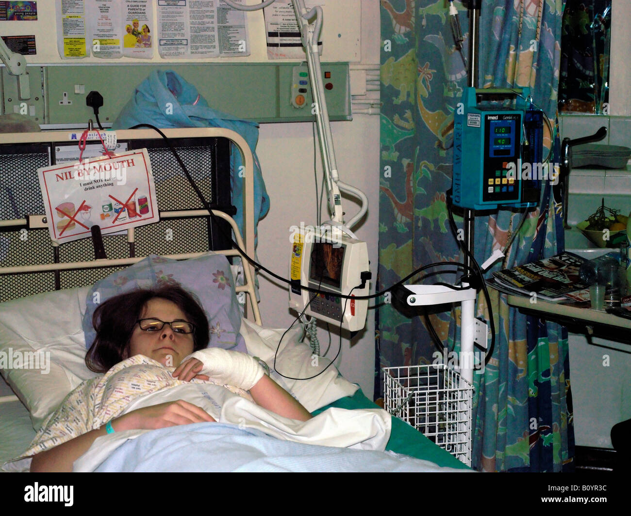Teenager in Hospital Bed with drip stand bag and stand Stock Photo Alamy