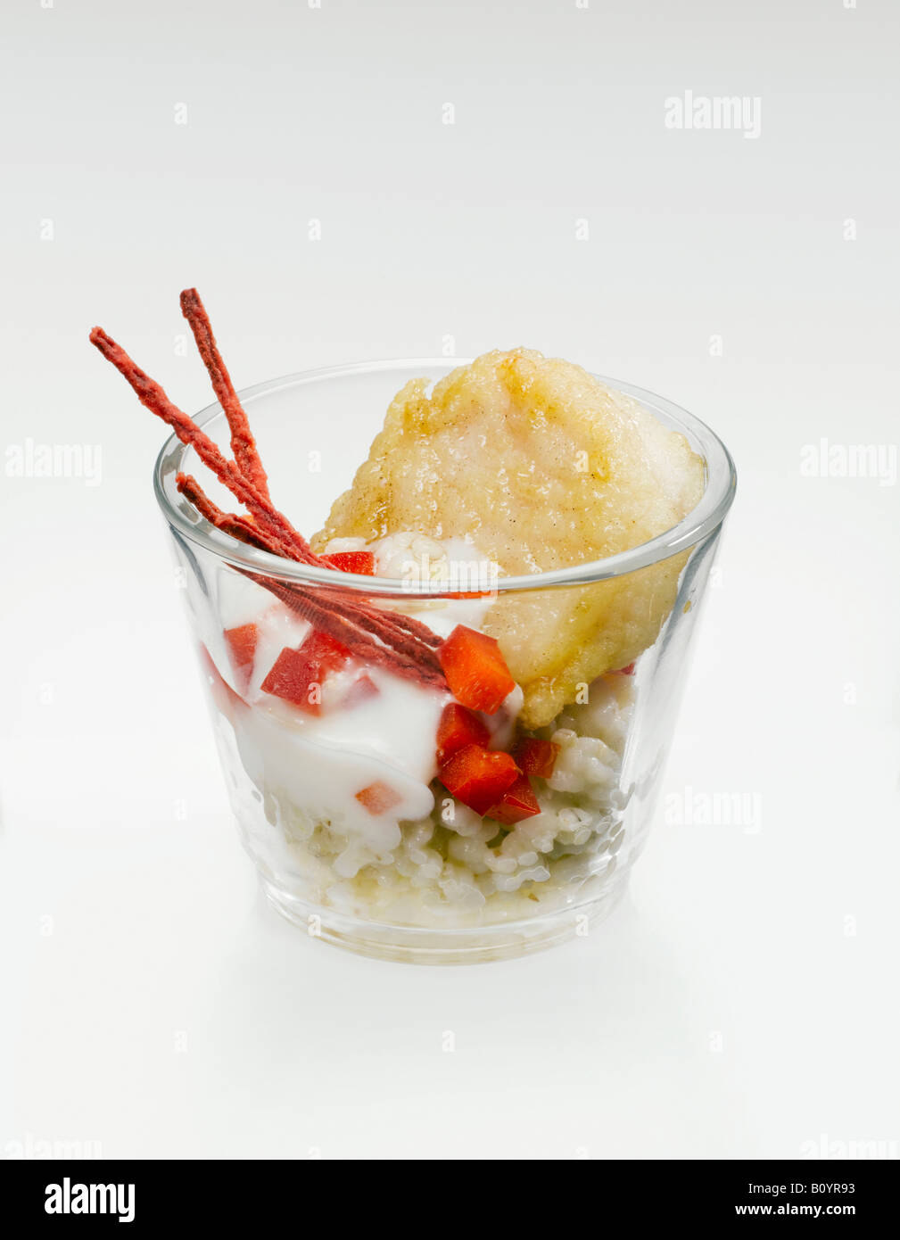 Fried Pangasius Filet with risotto rice in glass Stock Photo