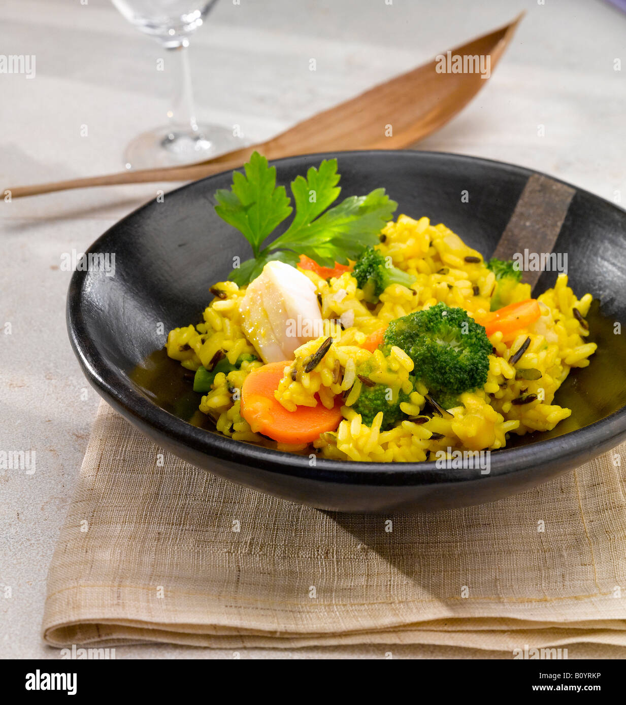 Curry dish in wooden bowl Stock Photo