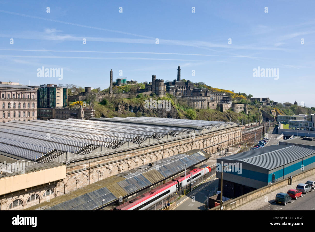 Roof structure of the east end of Waverley Railway Station in Edinburgh with a Virgin train at one of the platforms Stock Photo
