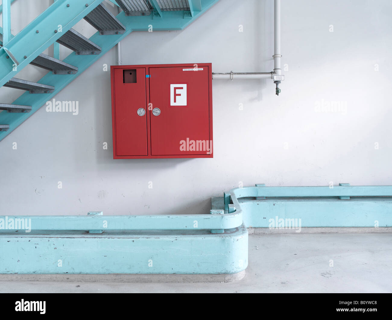 Fire extinguisher under stairs Stock Photo Alamy