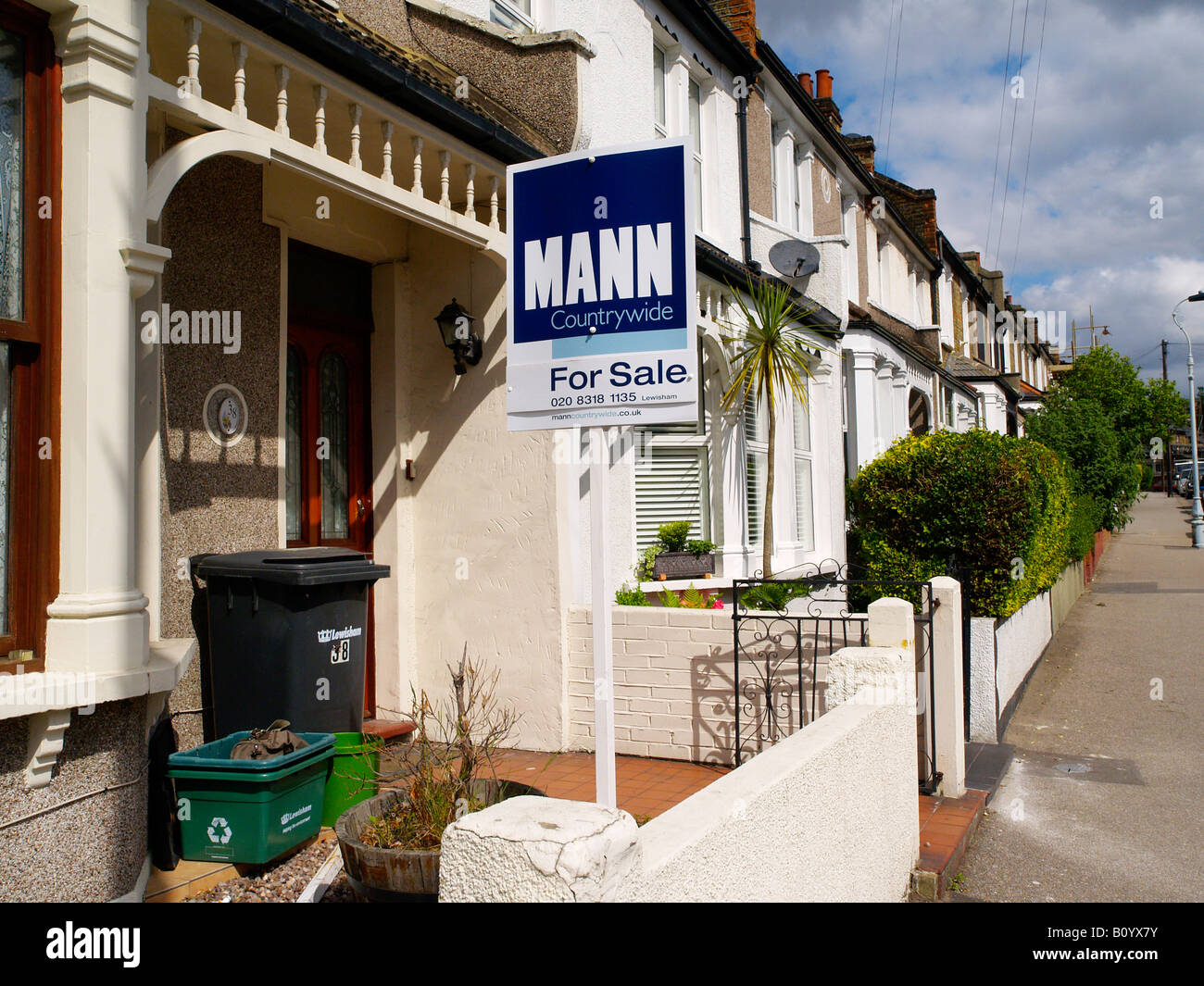 For sale sign in a row of terraced houses in Lewisham London SE4 Stock
