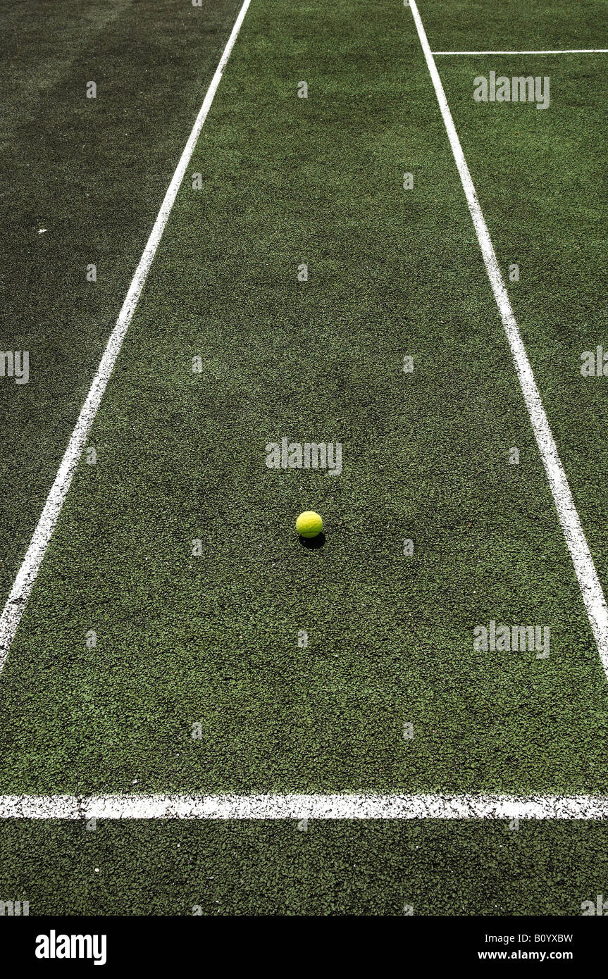 Tennis ball on tennis court with lines Stock Photo Alamy