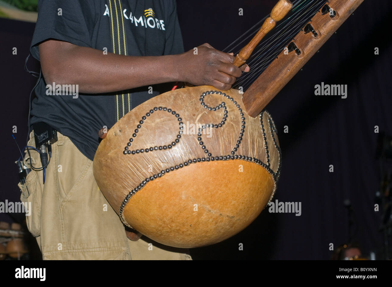 Kora detail showing strings and hand position This instrument is being held by N Faly Kouyate during a sound check Stock Photo