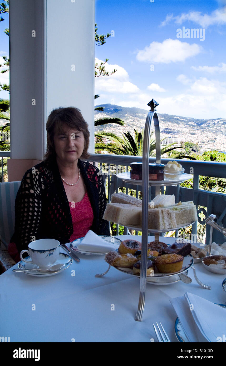 dh Reids Hotel FUNCHAL MADEIRA Woman tourist afternoon tea on Reids