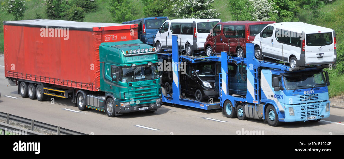 Two articulated lorries in overtaking manoeuvre on m25 motorway Stock