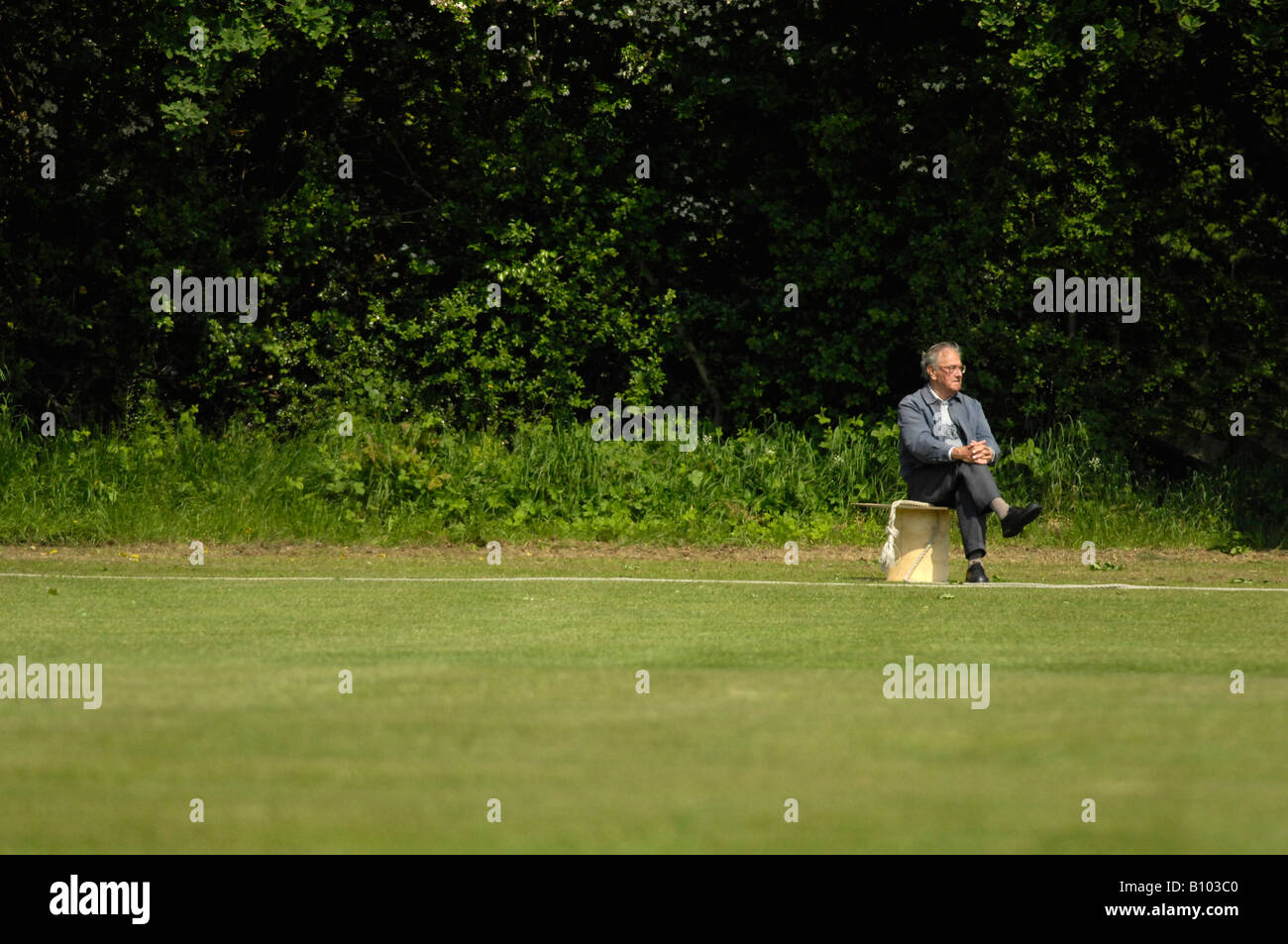 man sitting on seat Stock Photo - Alamy