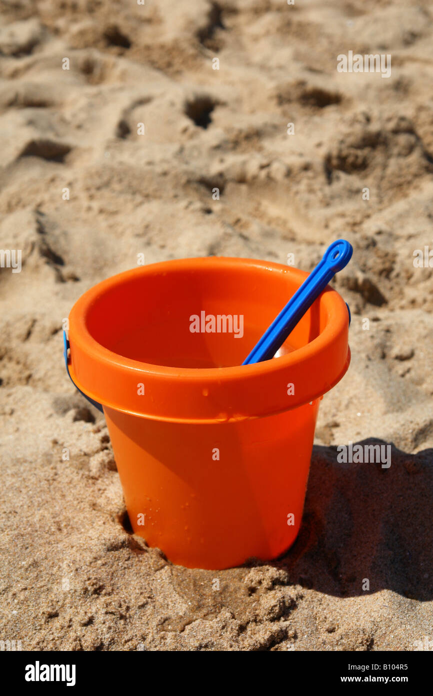 Beach bucket at the sand Stock Photo
