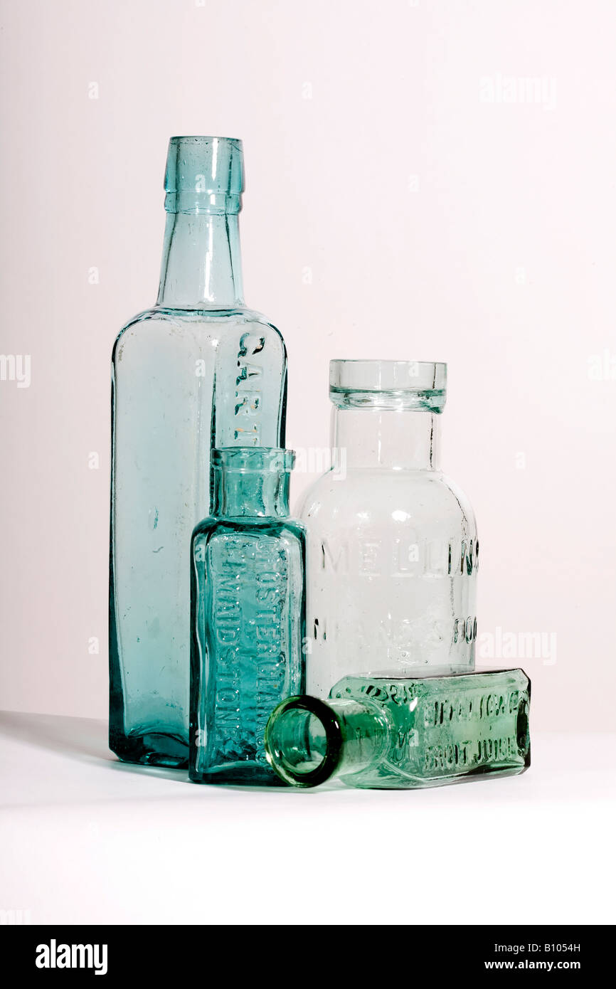 Four antique green glass container used for the storage of infant food