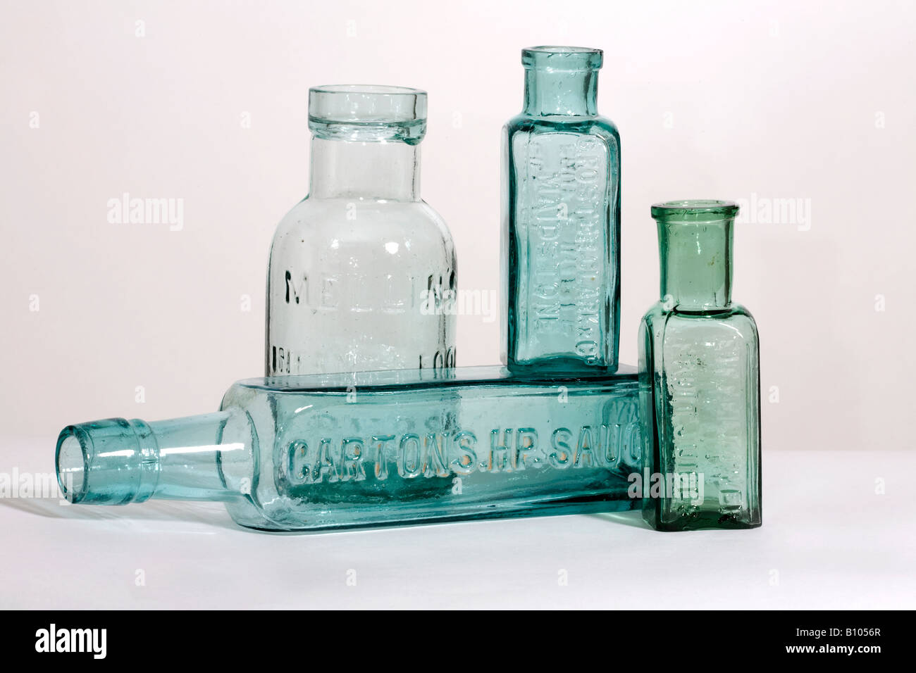 Four antique green glass container used for the storage of infant food